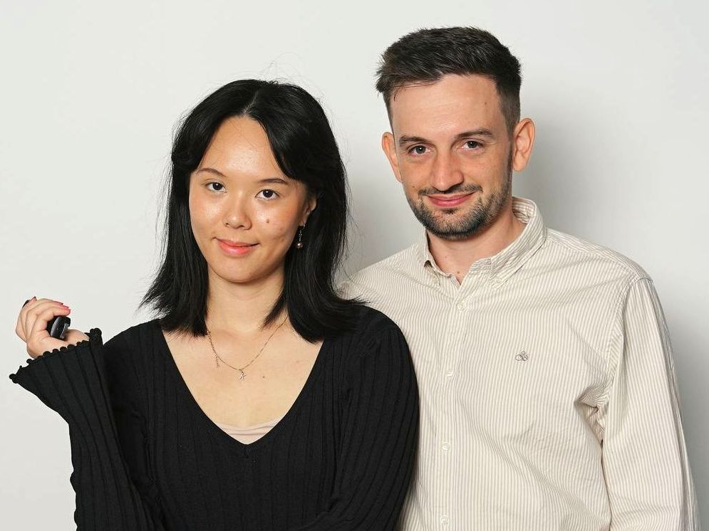 A man and a woman are posing for a picture together.
