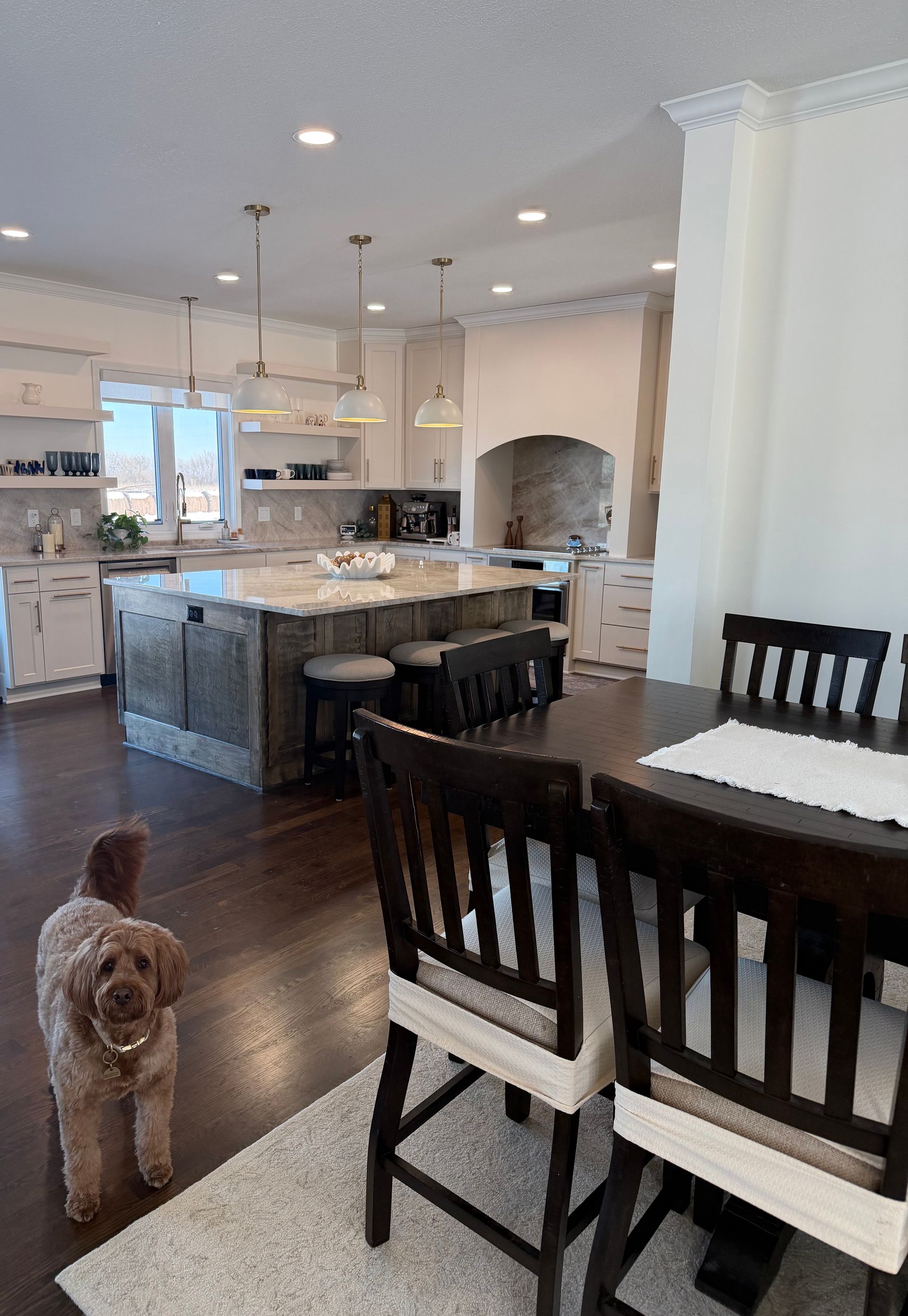 A living room with a couch and lots of windows