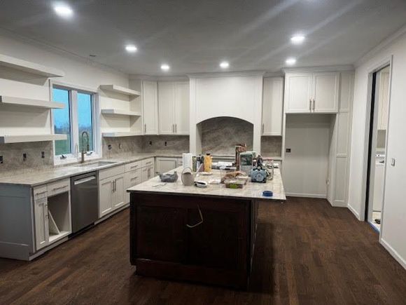 A black house with a lot of windows and doors