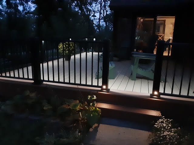 A kitchen with lots of windows and a sink