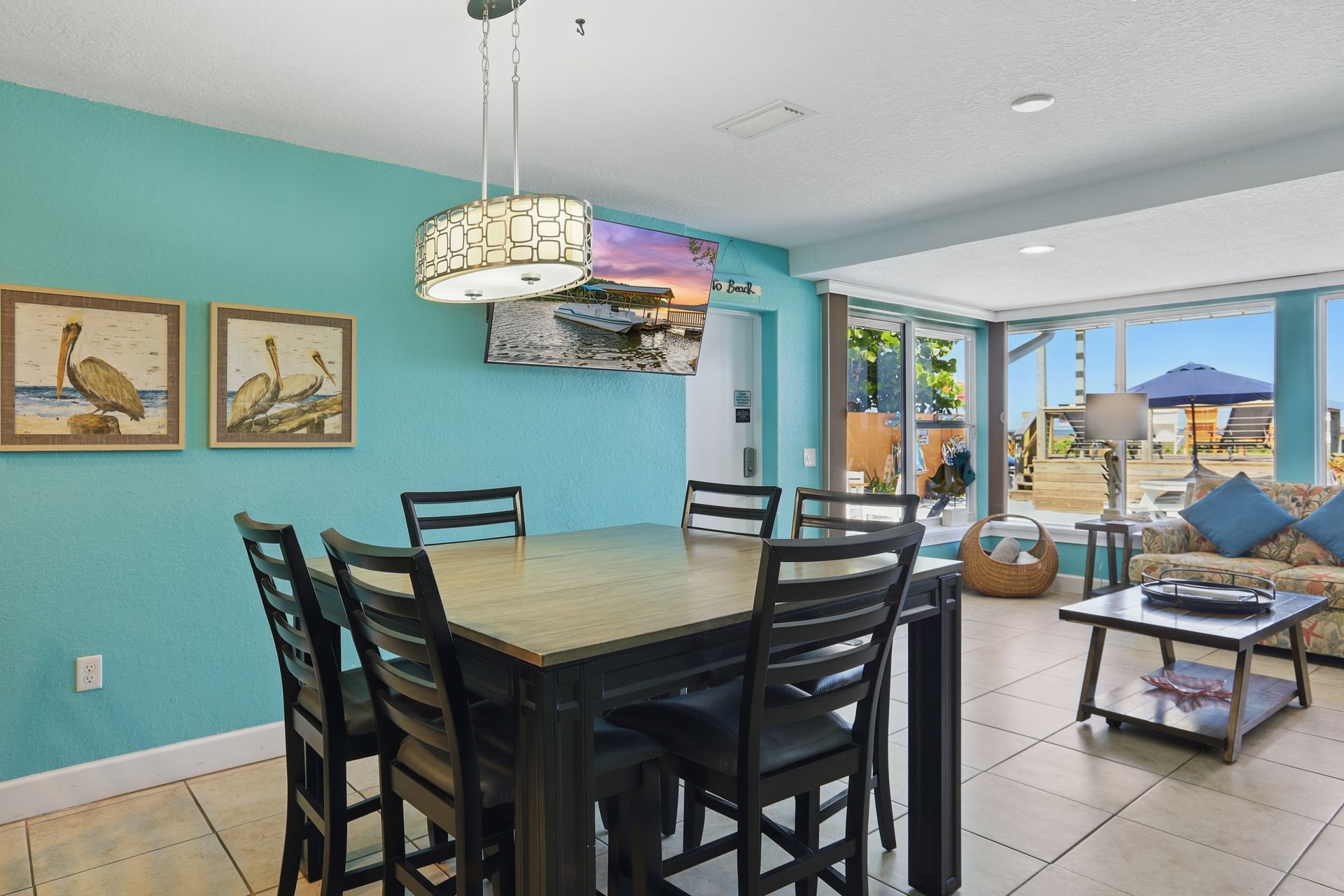 There is a dining table and chairs in the living room.