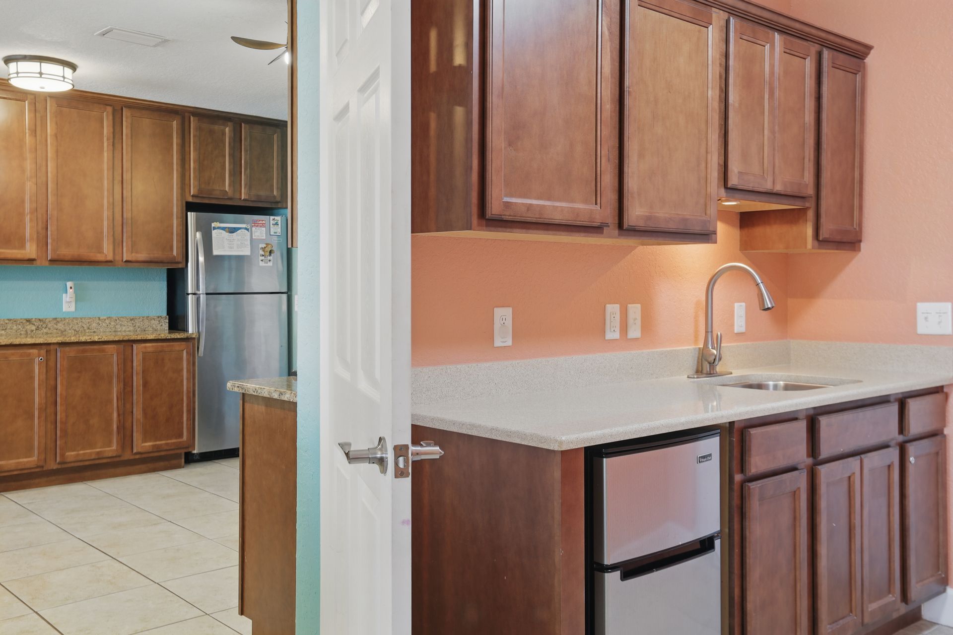 A kitchen with wooden cabinets and stainless steel appliances
