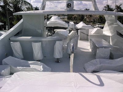 The inside of a boat covered in white plastic