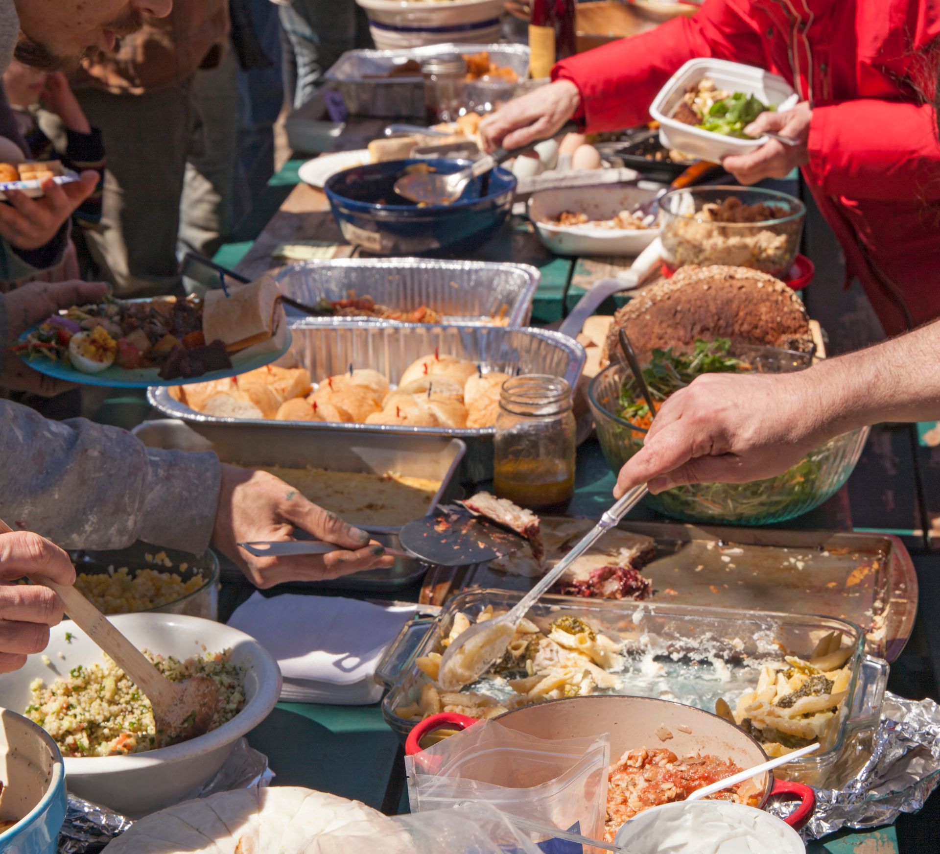 A group of people are sitting at a table eating food