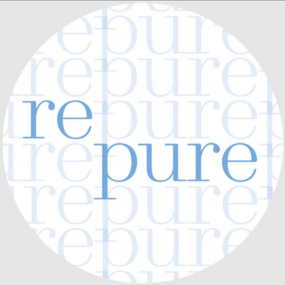 A white circle with the word repure on it