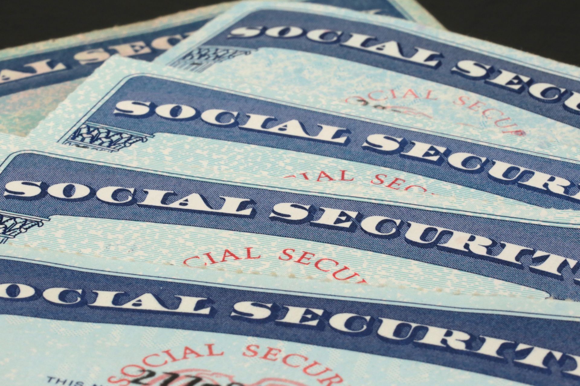 Several Social Security Cards Are Stacked on Top of Each Other