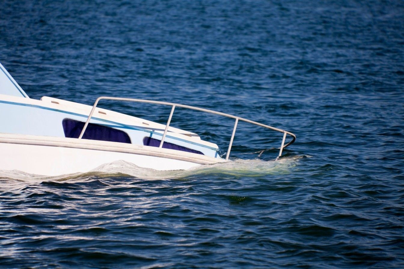 A boat is floating on top of a body of water.