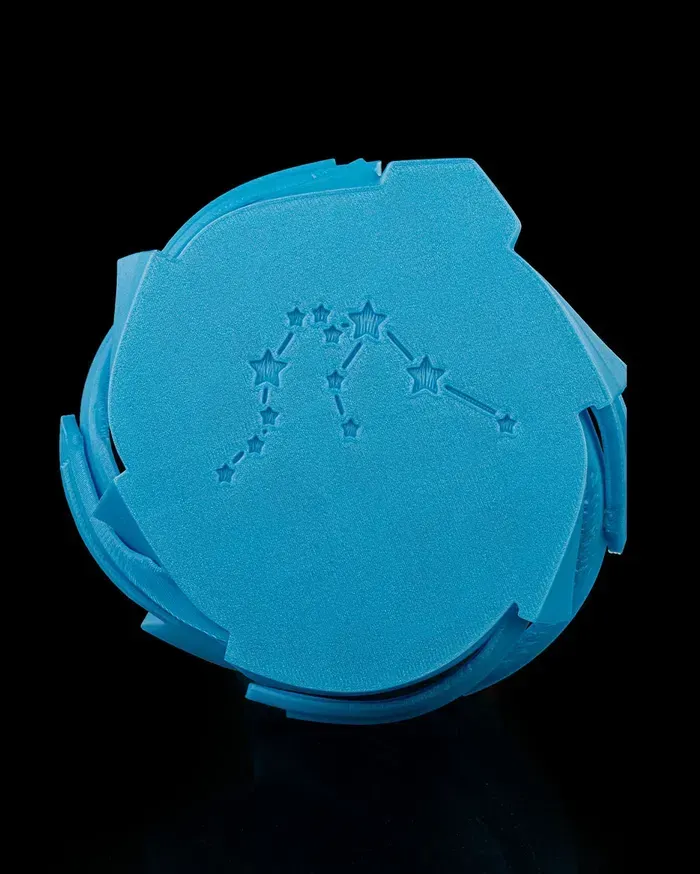 A blue statue of an aquarius zodiac sign