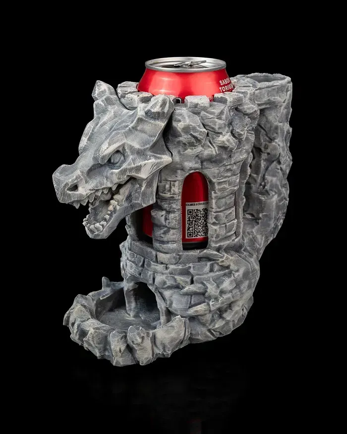A can of soda is sitting inside of a statue of a dragon.