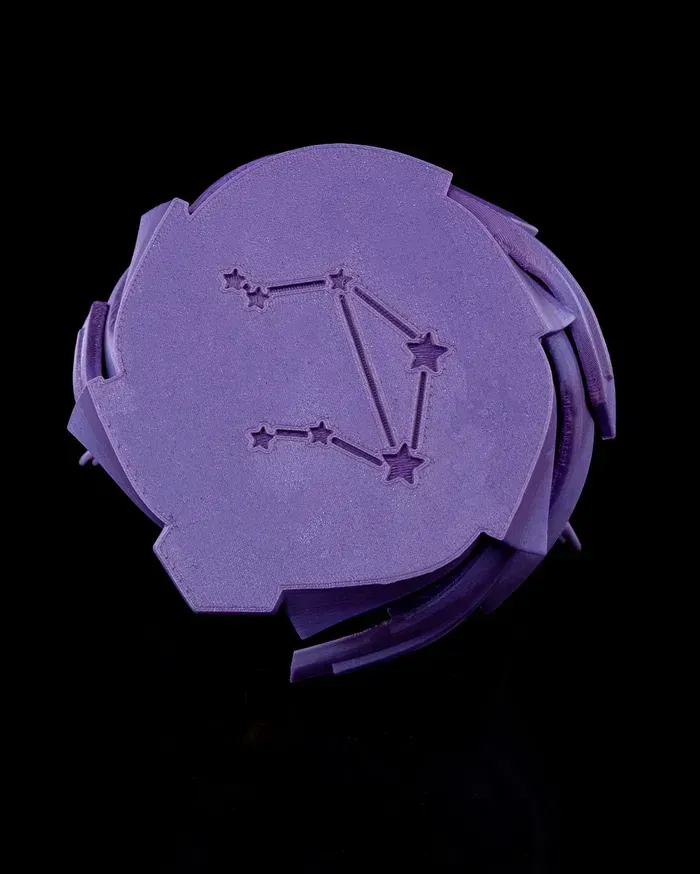 A purple statue of a woman holding scales on a black background.