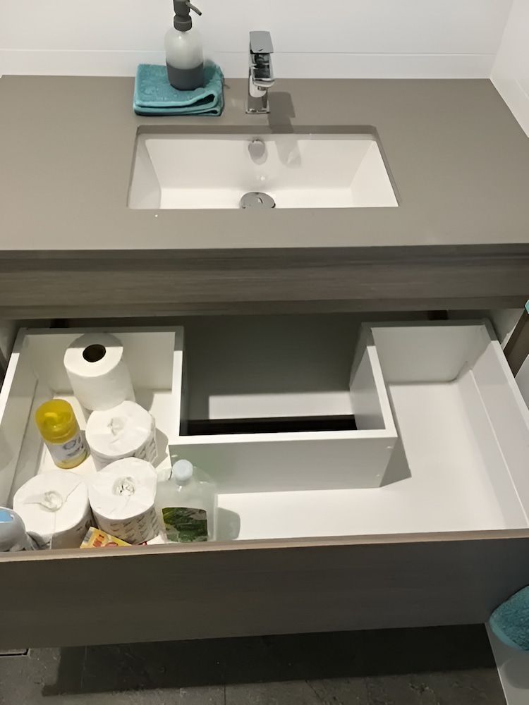 A Bathroom Sink With A Drawer Full Of Toilet Paper — United Kitchens and Joinery in Oak Flats, NSW