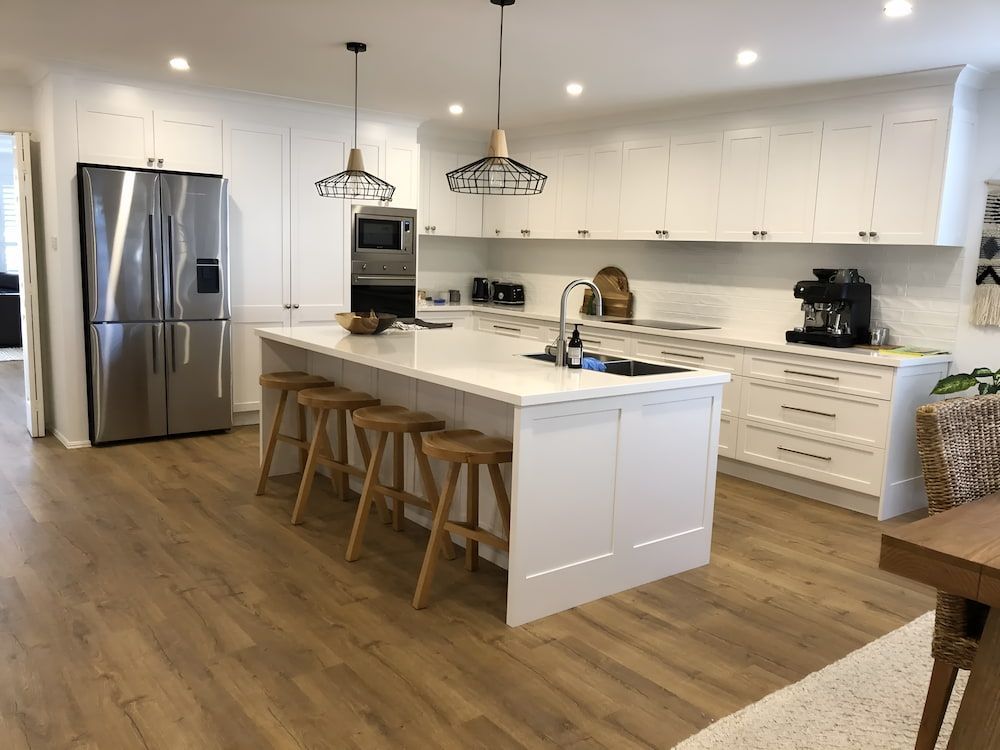 There Is A Large Island In The Middle Of The Kitchen — United Kitchens and Joinery in Oak Flats, NSW