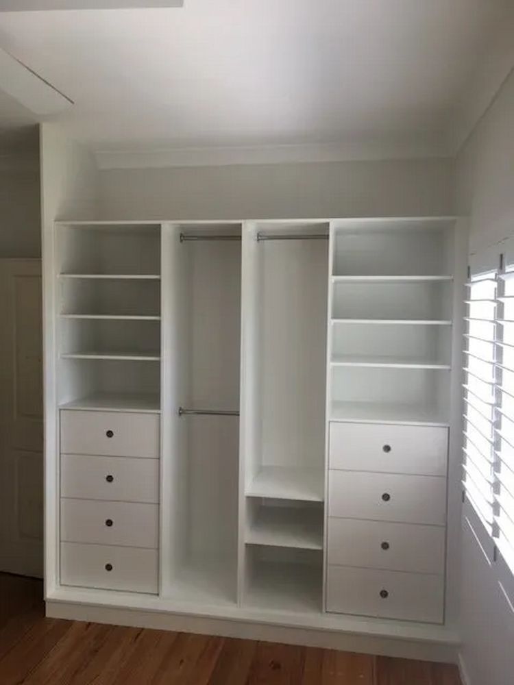 A Closet With Lots Of Shelves And Drawers In A Room With A Window — United Kitchens and Joinery in Oak Flats, NSW