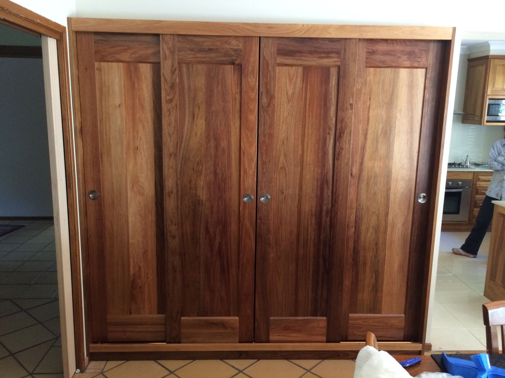 A Bedroom With A Bed, Dresser, Chair And Mirror — United Kitchens and Joinery in Oak Flats, NSW