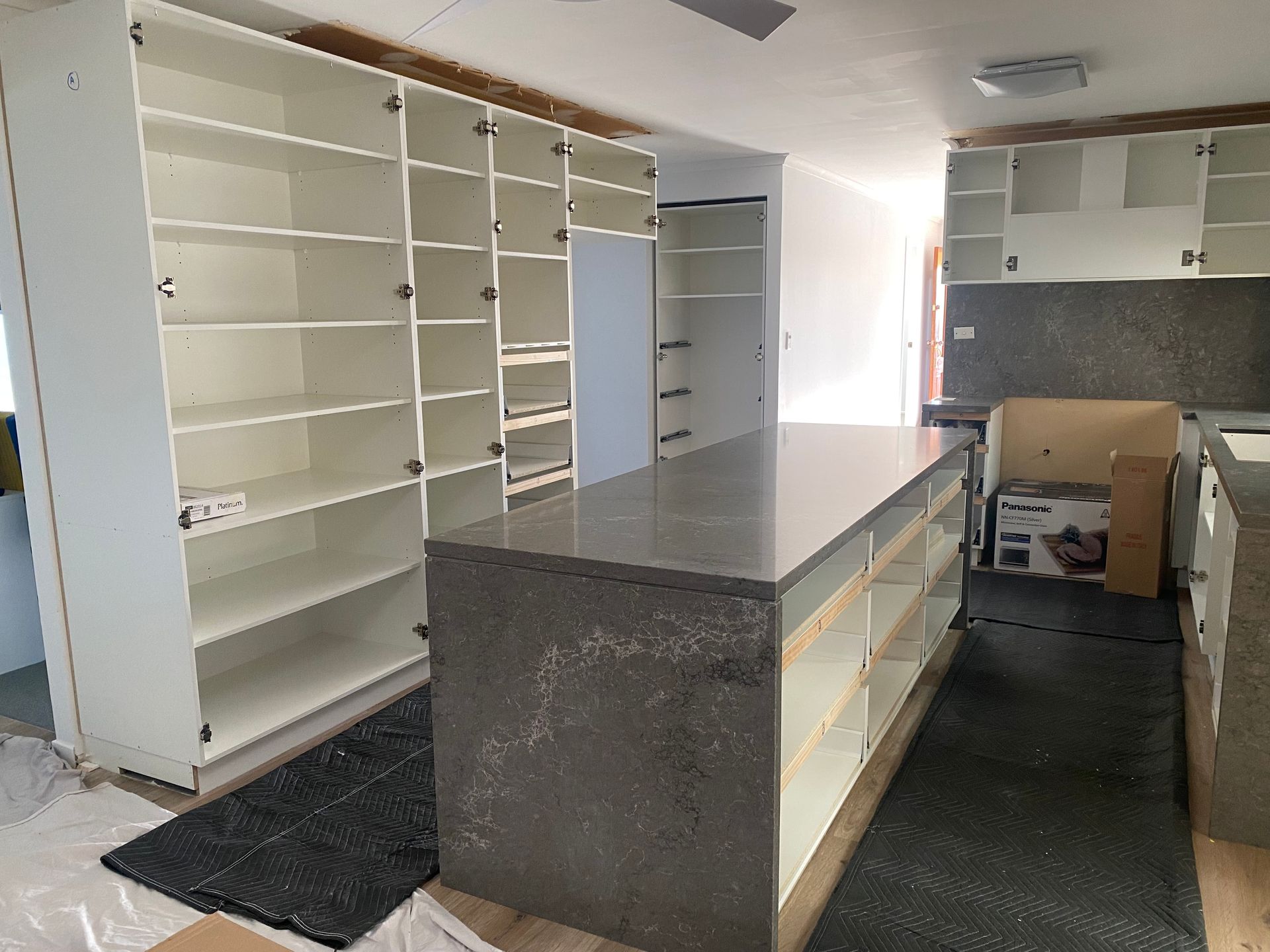 A Warehouse Filled With Lots Of Wooden Frames — United Kitchens and Joinery in Oak Flats, NSW