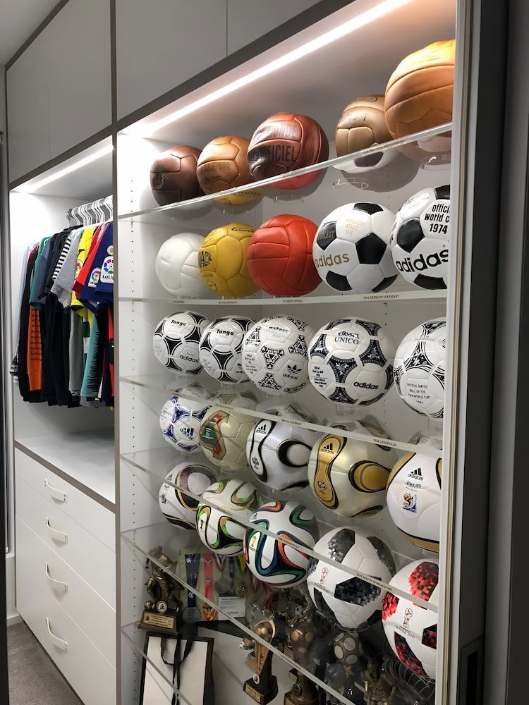 A Closet Filled With Lots Of Soccer Balls And Basketballs — United Kitchens and Joinery in Oak Flats, NSW