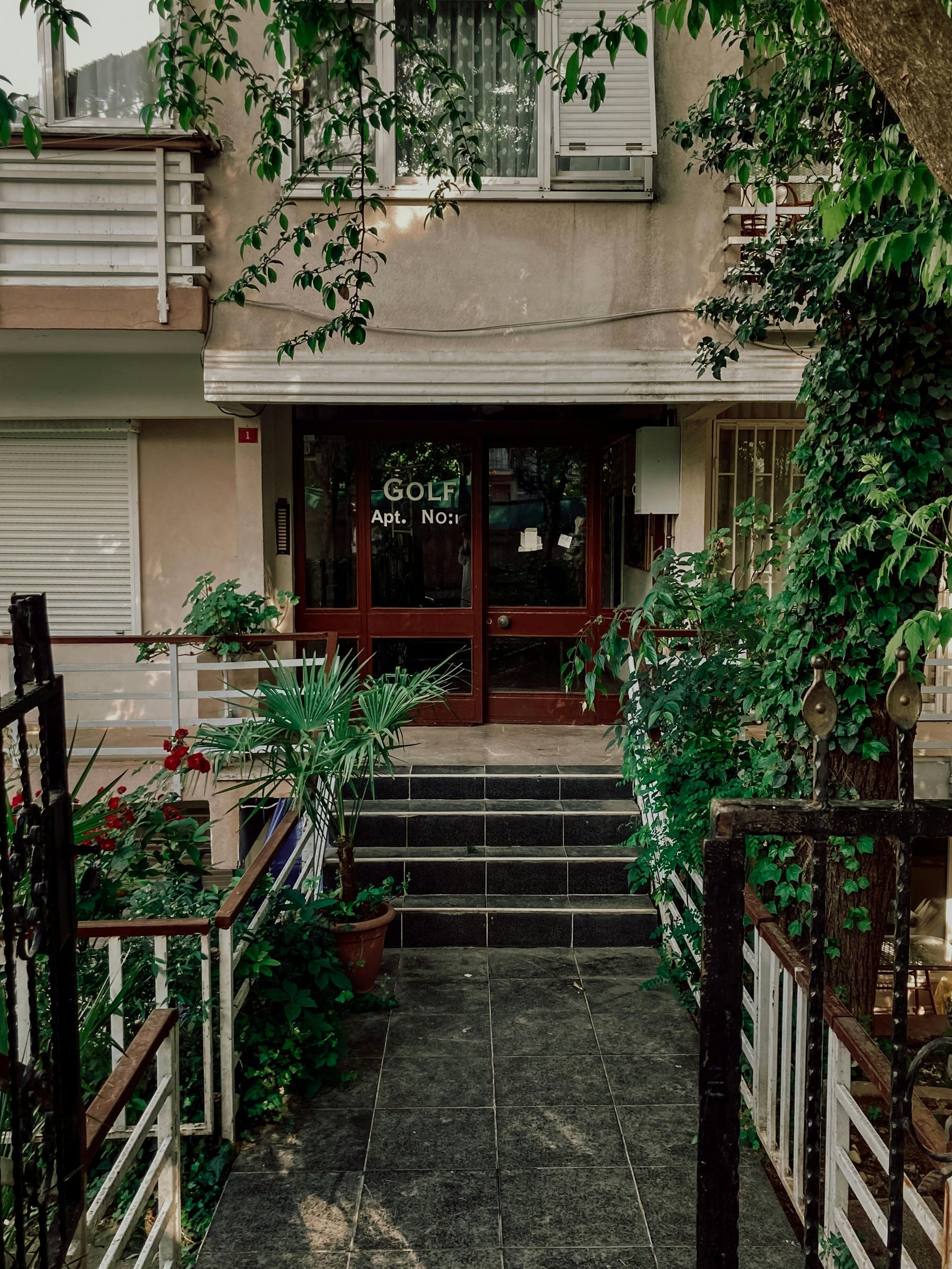 A building with stairs leading up to the front door