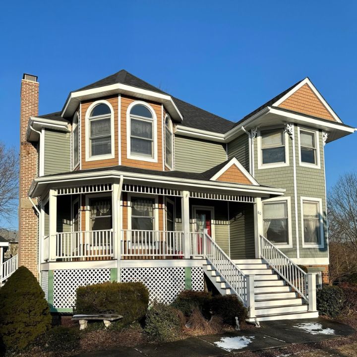 A large house with new siding.