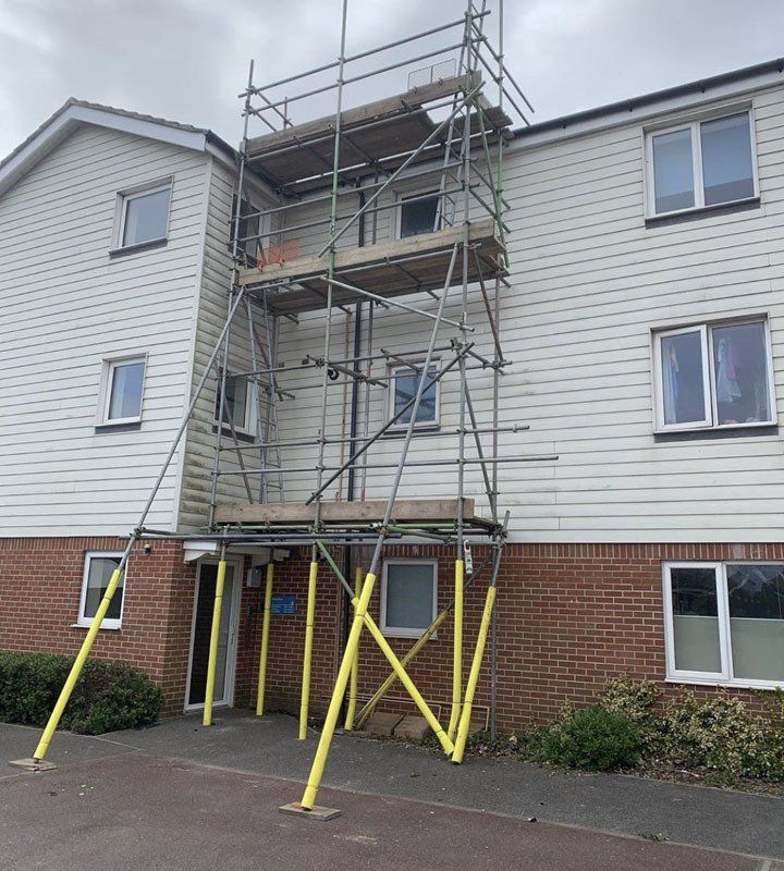 large house with scaffold with  a garden 9