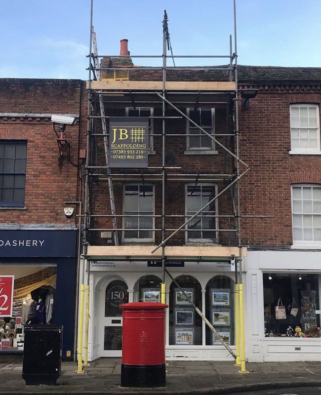 large house with scaffold with  a garden 10