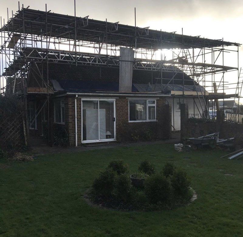 large house with scaffold with  a garden 2