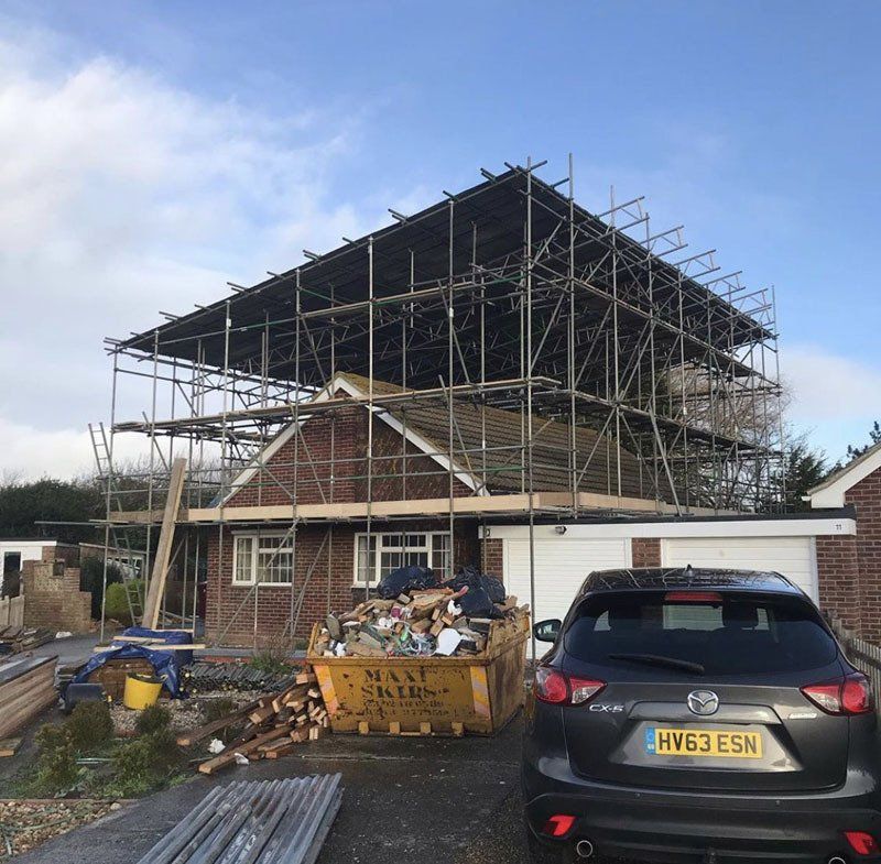 large house with scaffold with  a garden 3