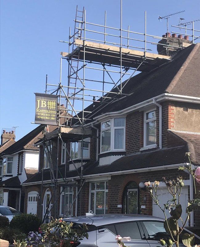 large house with scaffold with  a garden 5