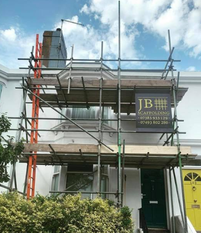 scaffold on a white house from garden 13