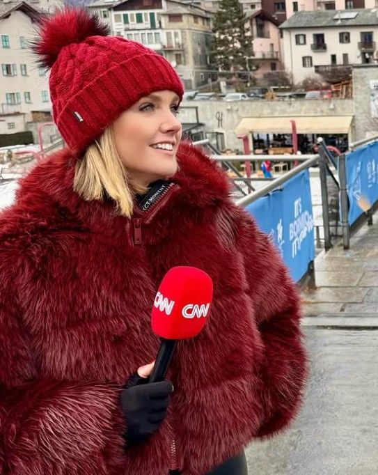 Woman wearing a black knit hat with