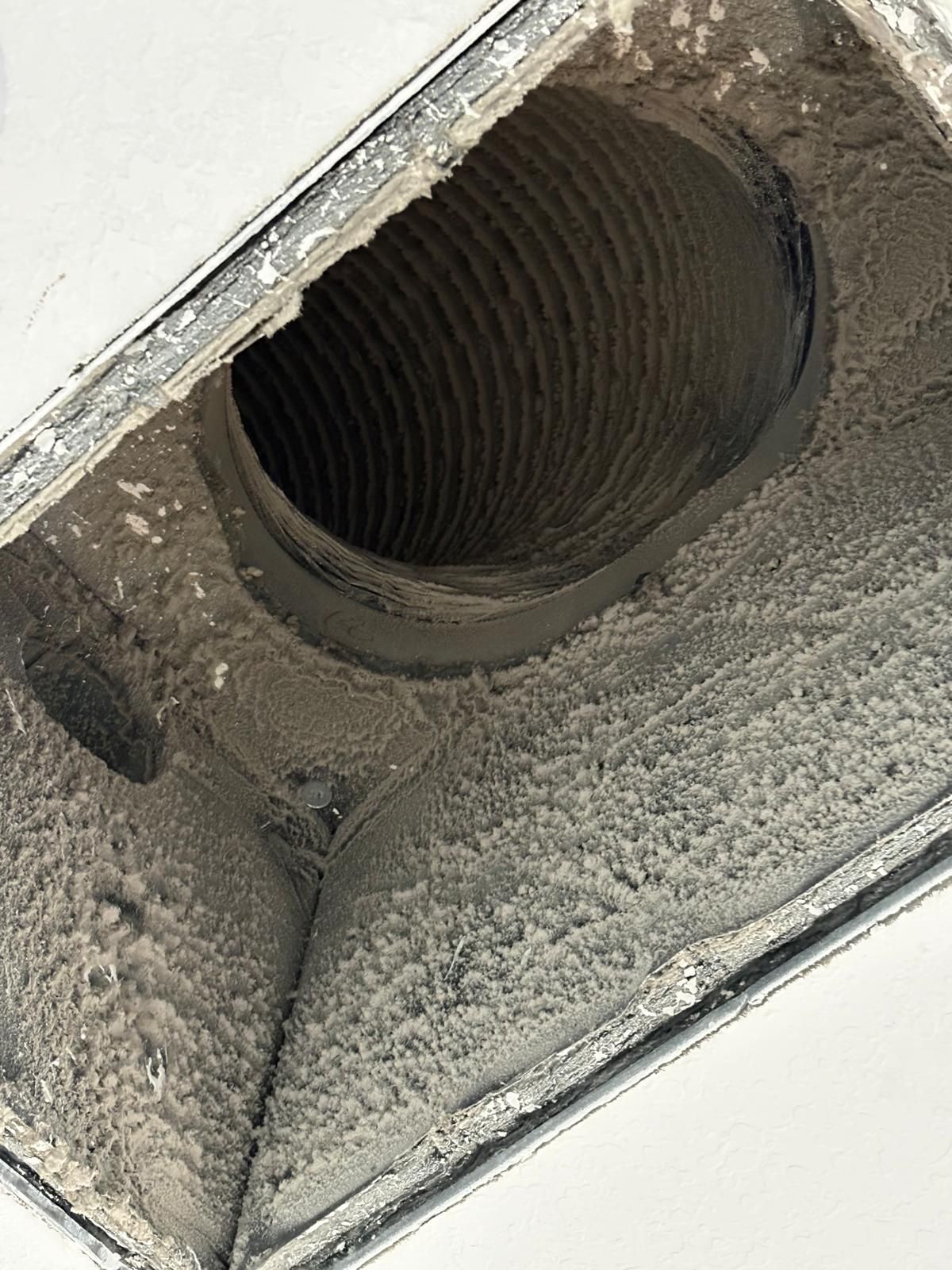 Dirty air vent opening into a dusty duct.