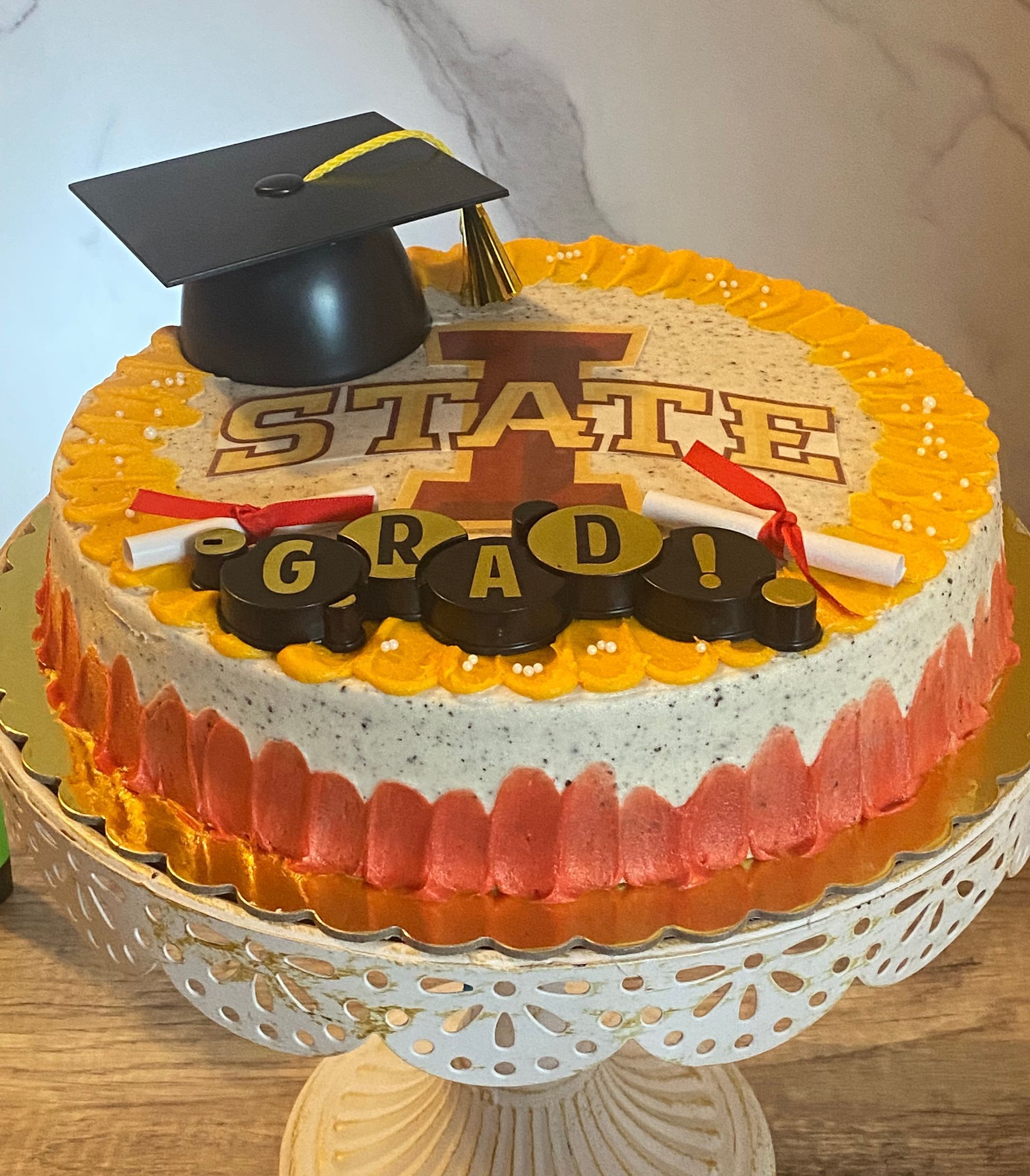 A cake with a graduation cap on top of it