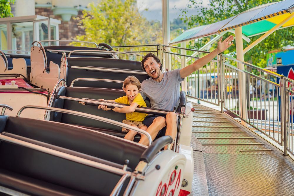 A Merry Go Round is Behind a Fence in a Field — Fun Time Amusements in Yeppoon, QLD