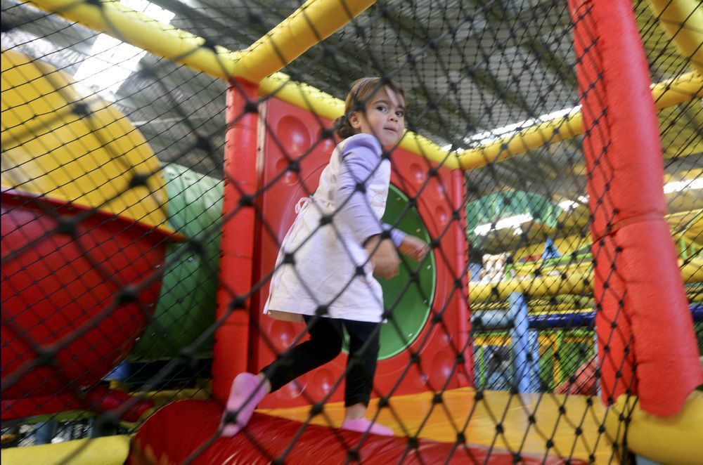 A Group of People Are Riding Bumper Cars at an Amusement Park — Fun Time Amusements in Mackay, QLD
