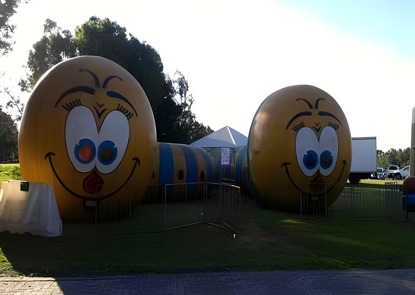 Two Inflatable Smiley Faces Next to Each Other — Fun Time Amusements in Gracemere, QLD