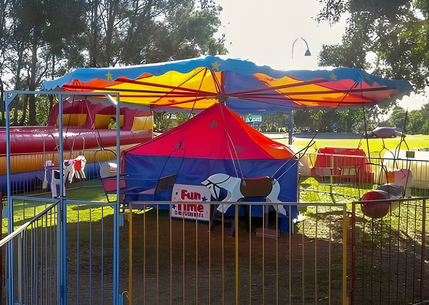 A Colourful Tent With a Sign That Says Fun Time — Fun Time Amusements in Gracemere, QLD