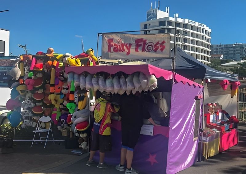 A Purple Tent With a Sign That Says Fairy Floss — Fun Time Amusements in Gracemere, QLD