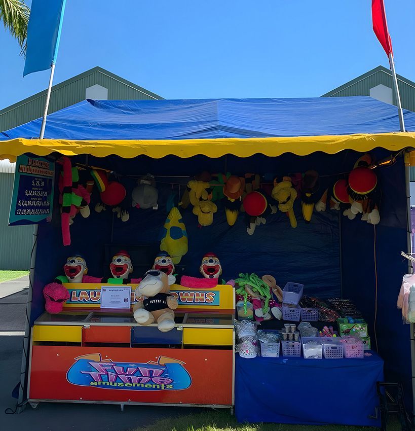 A Carnival Booth With Stuffed Toys on It