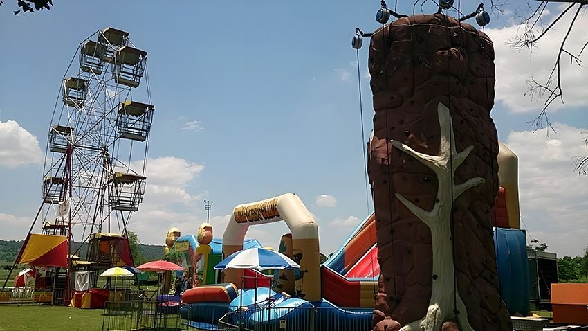 A Carnival With a Ferris Wheel and a Climbing Wall — Fun Time Amusements in Gracemere, QLD