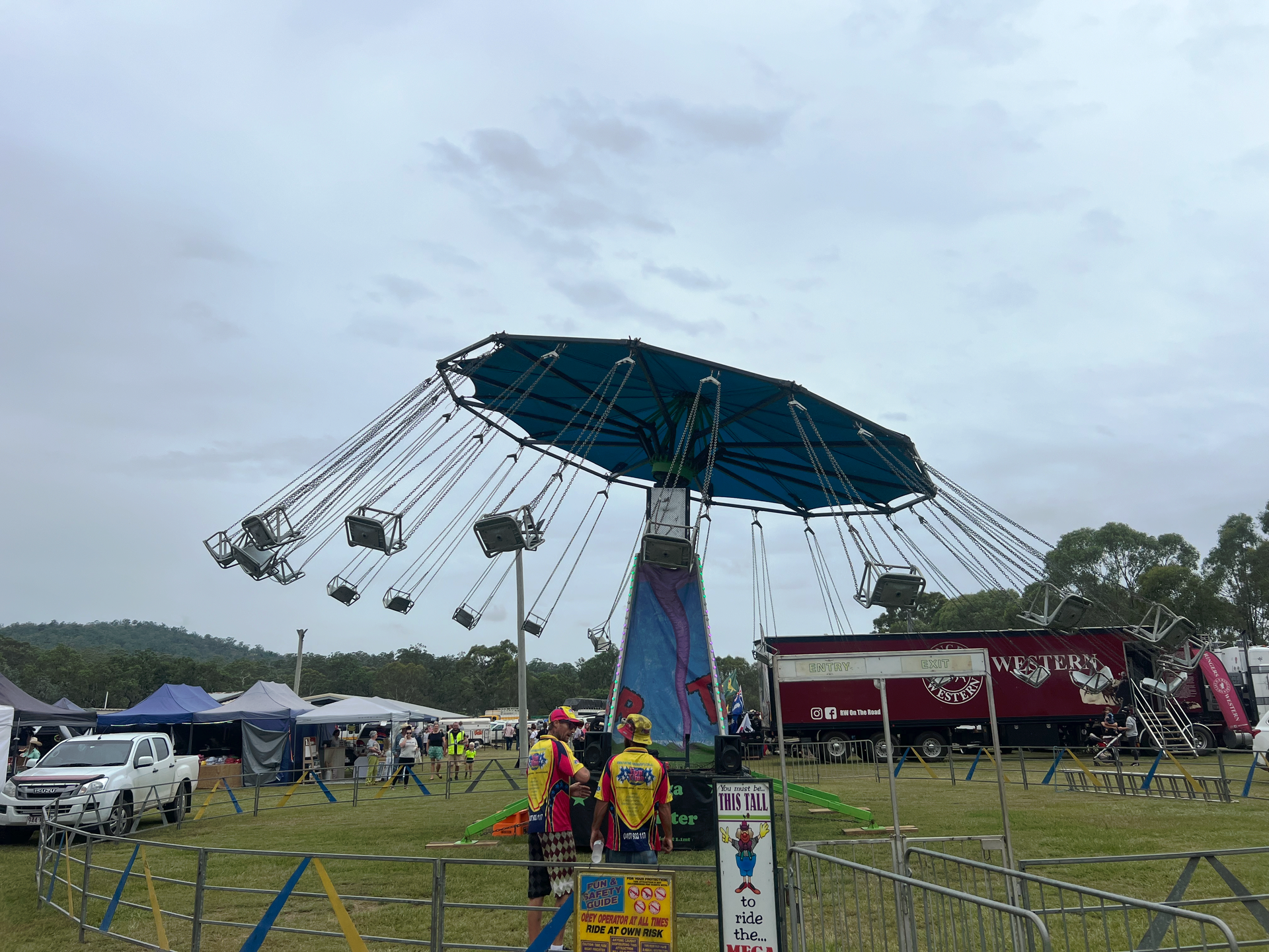 A Carousel Ride at an Outdoor Fair With a Cloudy Sky — Fun Time Amusements in Gracemere, QLD