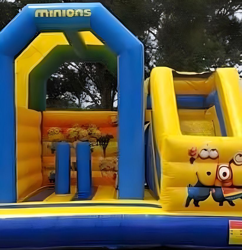 A Yellow and Blue Bouncy House With Minions on It — Fun Time Amusements in Gracemere, QLD
