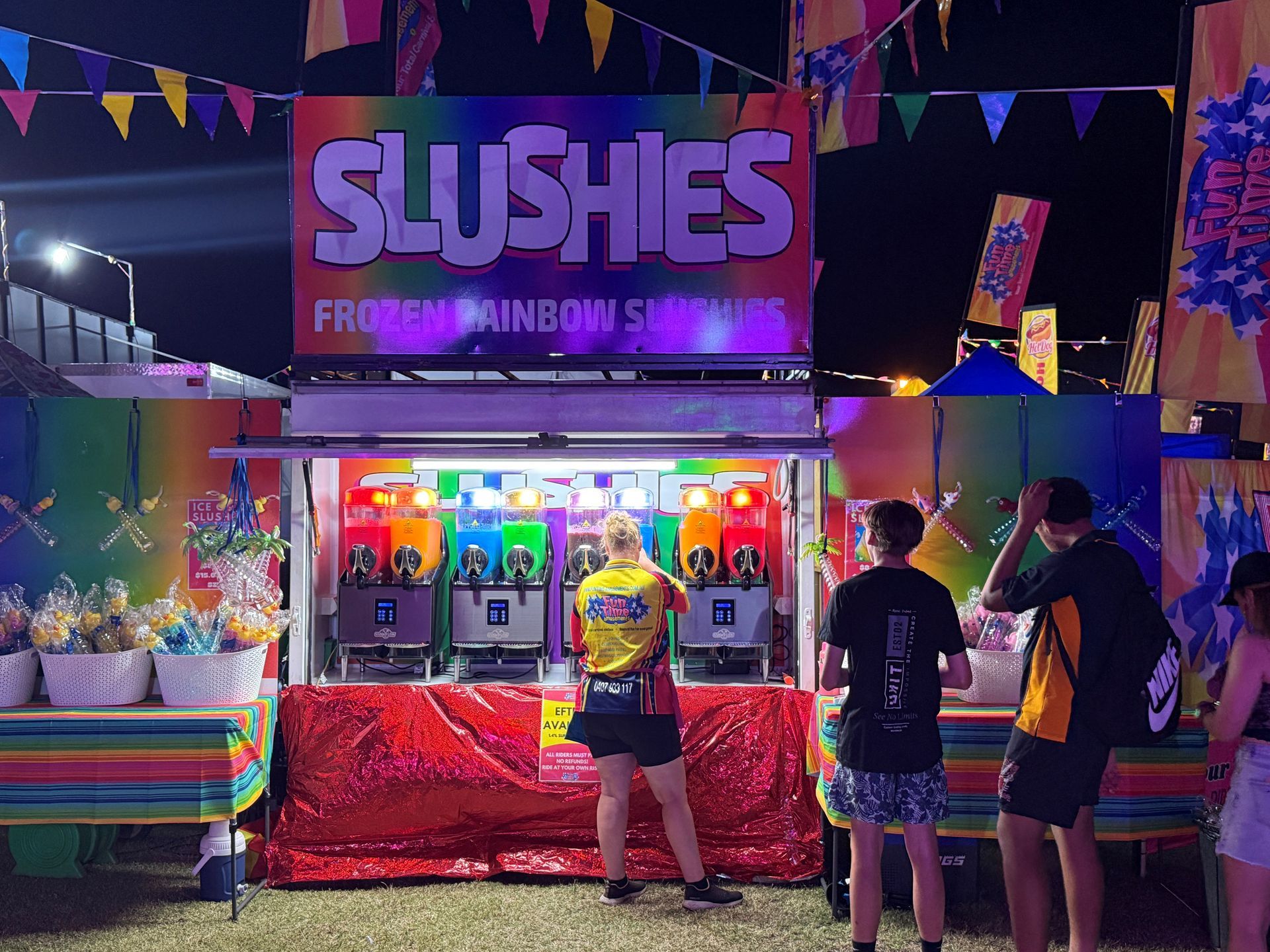 Girl Smiles, Holding Pink Cotton Candy at a Carnival — DNA Aquatics in Bundaberg, QLD