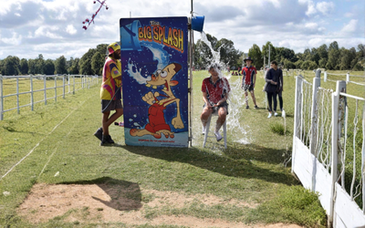 Boy Watches as Woman Gets Splashed by a Water Bucket at a Water Park — Fun Time Amusements in Gracemere, QLD