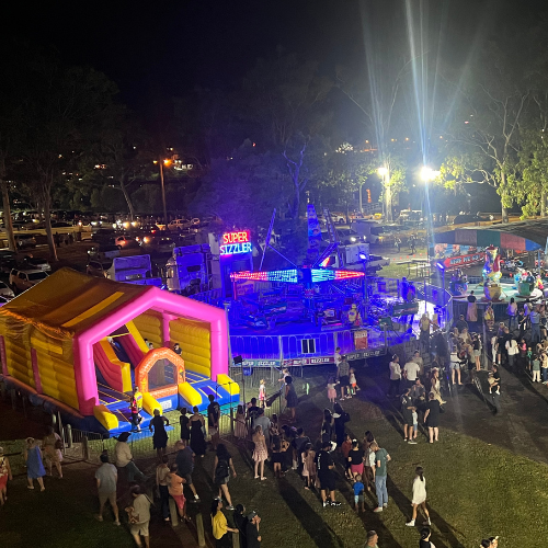 Ticket Booth at a Carnival With a Ride in the Background — DNA Aquatics in Bundaberg, QLD