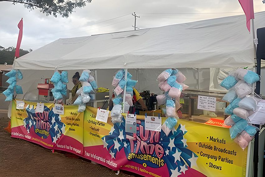 A Row of Cotton Candy Stands Under a Tent — Fun Time Amusements in Gracemere, QLD