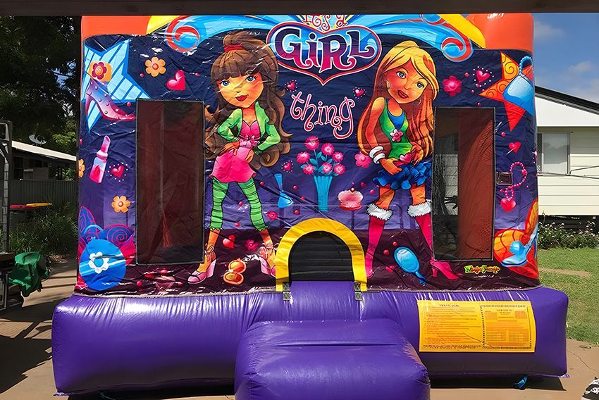 A Purple Bouncy House With Two Girls on It