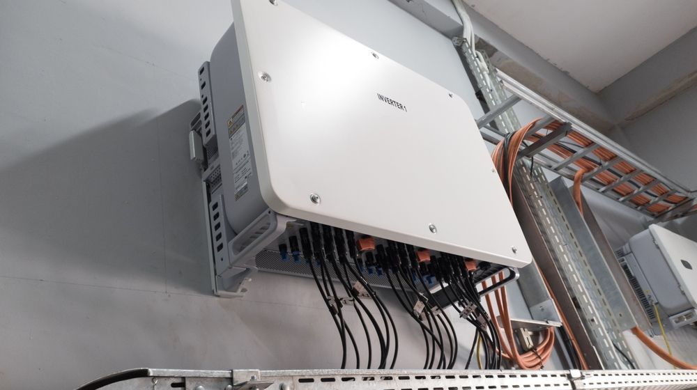 Wall-Mounted Electrical Control Box with Cables in An Industrial Ceiling Area — Local Light Electrical in Suffolk Park, NSW