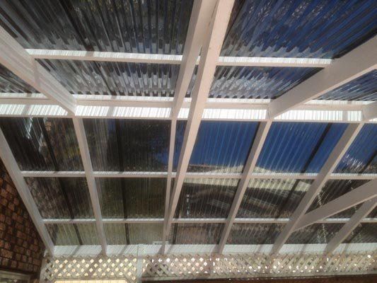 A ceiling with a blue roof and a white frame.