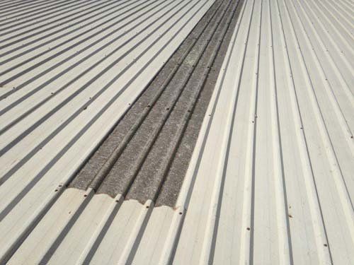 A close up of a white corrugated metal roof.