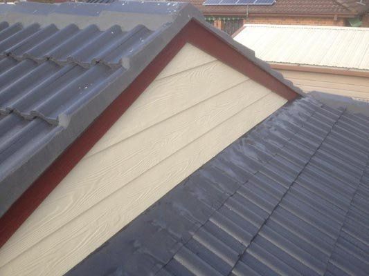 A close up of a roof with a triangle on it