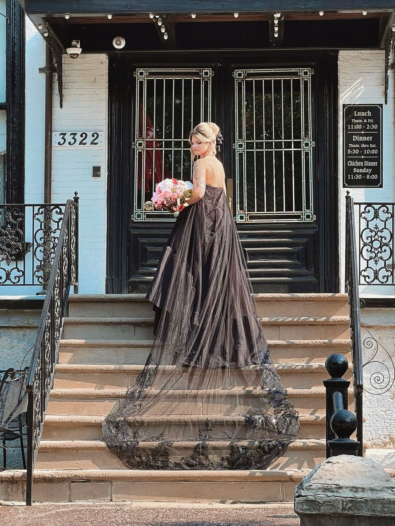 A woman is holding a pair of scissors in her hand.